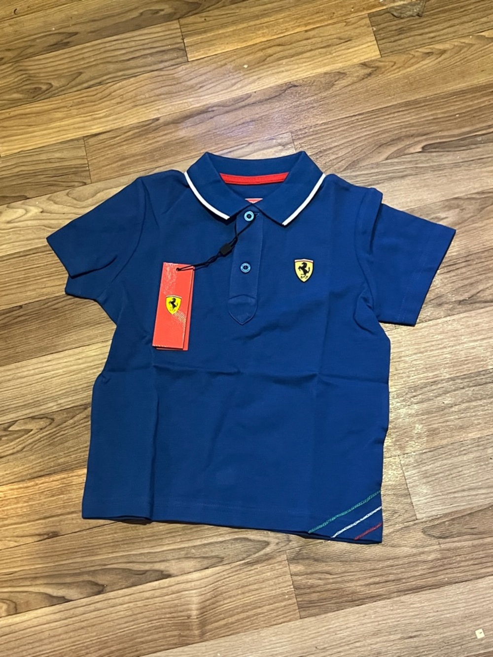 Ferrari Blue Polo with White Trim and Red Tag